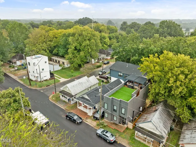 an aerial view of a house with a big yard