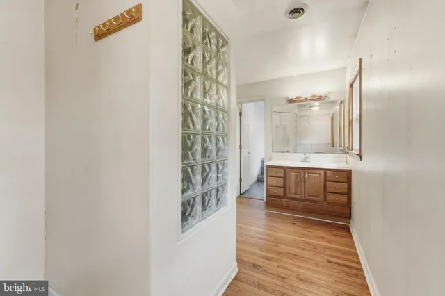 a bathroom with shower and mirror