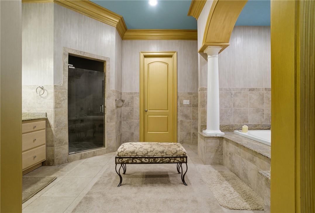 2328 Spindrift Road Virginia Beach, VA 23451 - Photo 29 of 50 Full bathroom featuring tile patterned floors, crown molding, a bath, tile walls, and vanity