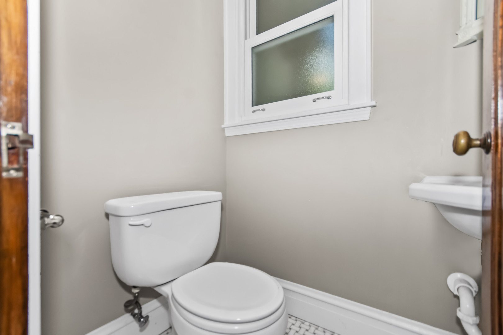 525 Wisner Street Park Ridge, IL 60068 - Photo 15 of 37 a white toilet sitting next to a bathroom sink