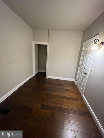 311 Elm Street, Unit 1 Reading, PA 19601 - Photo 13 of 20 a view of an empty room with wooden floor and stairs