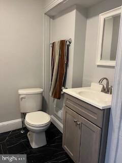 311 Elm Street, Unit 1 Reading, PA 19601 - Photo 20 of 20 a bathroom with a granite countertop toilet sink and mirror