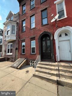311 Elm Street, Unit 1 Reading, PA 19601 - Photo 2 of 20 a view of a brick building with many windows