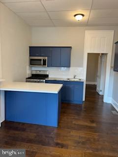 311 Elm Street, Unit 1 Reading, PA 19601 - Photo 5 of 20 a kitchen with wooden floors and a sink
