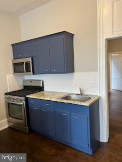 311 Elm Street, Unit 1 Reading, PA 19601 - Photo 6 of 20 a kitchen with stainless steel appliances granite countertop a stove a sink and a microwave