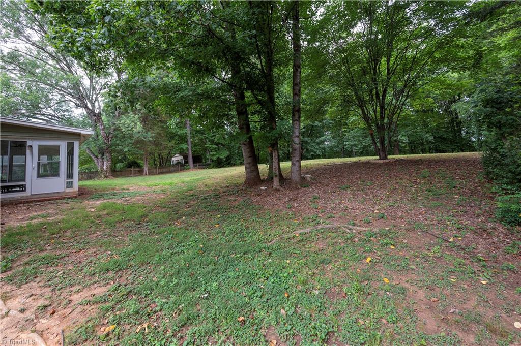 7013 Upland Road Clemmons, NC 27012 - Photo 41 of 43 Level and gently sloping fenced back yard
