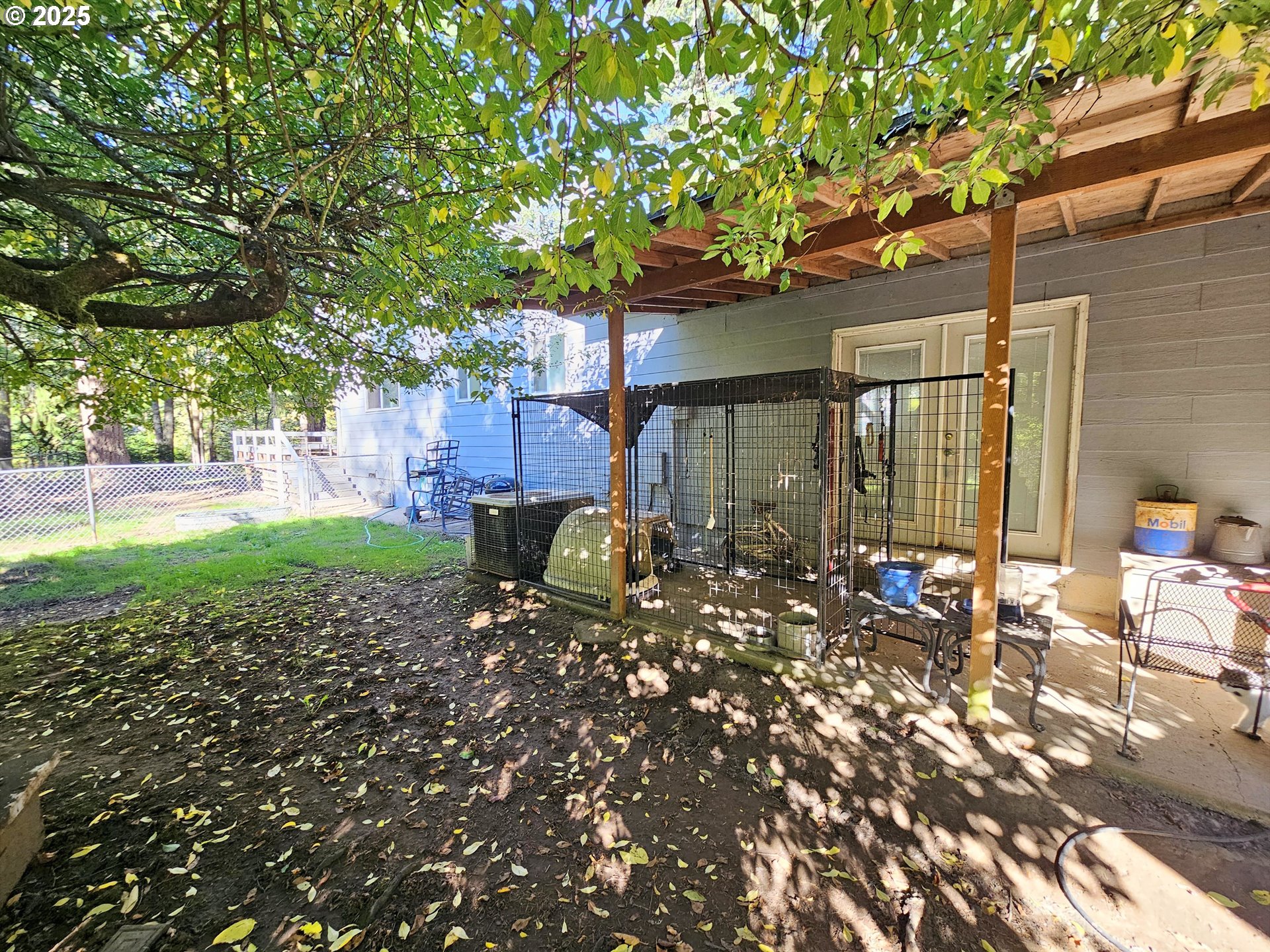 3463 Briarwood Road Umpqua, OR 97486 - Photo 14 of 29 a backyard of a house with table and chairs