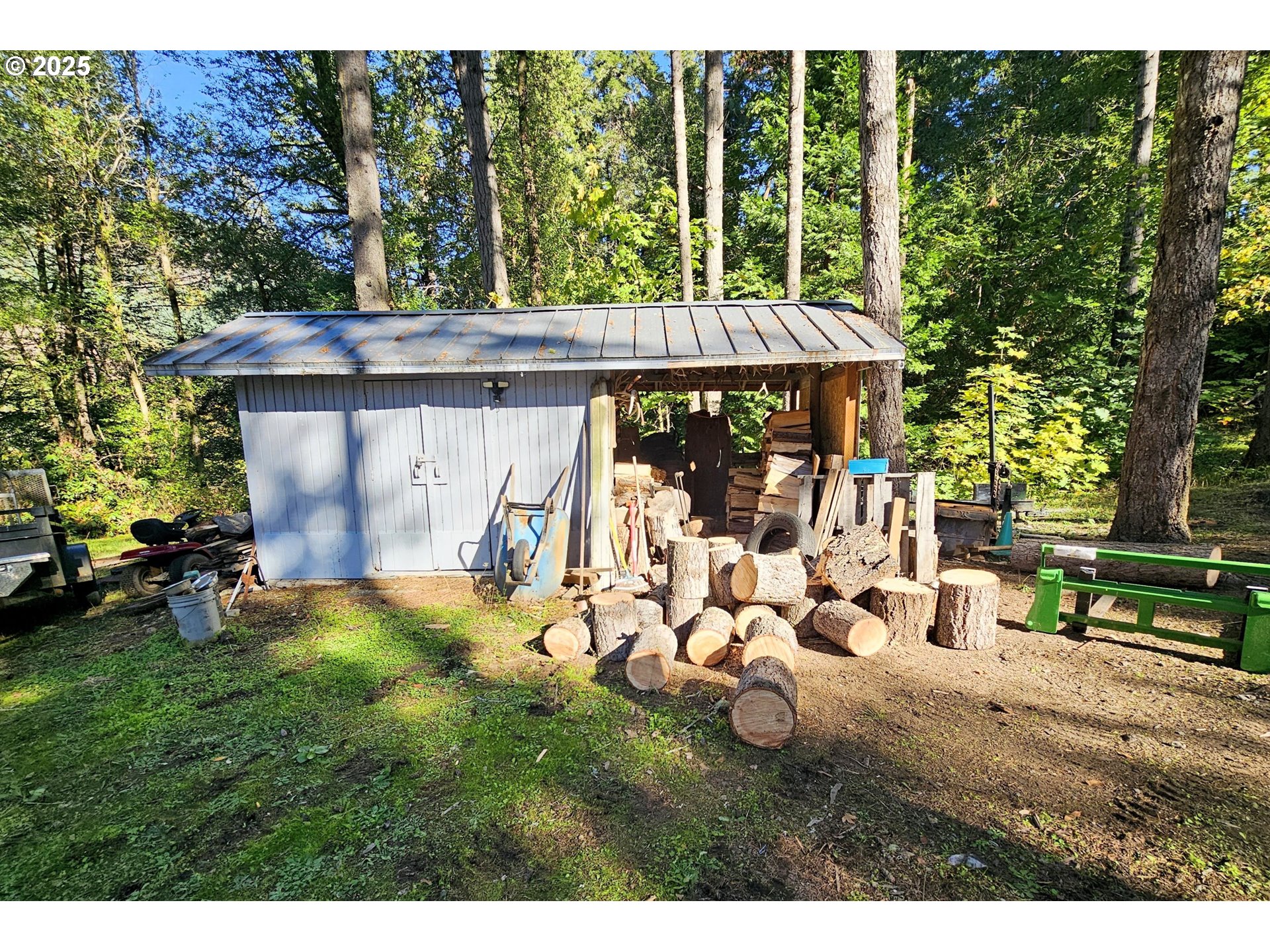 3463 Briarwood Road Umpqua, OR 97486 - Photo 24 of 29 a view of a chair and table in backyard of the house
