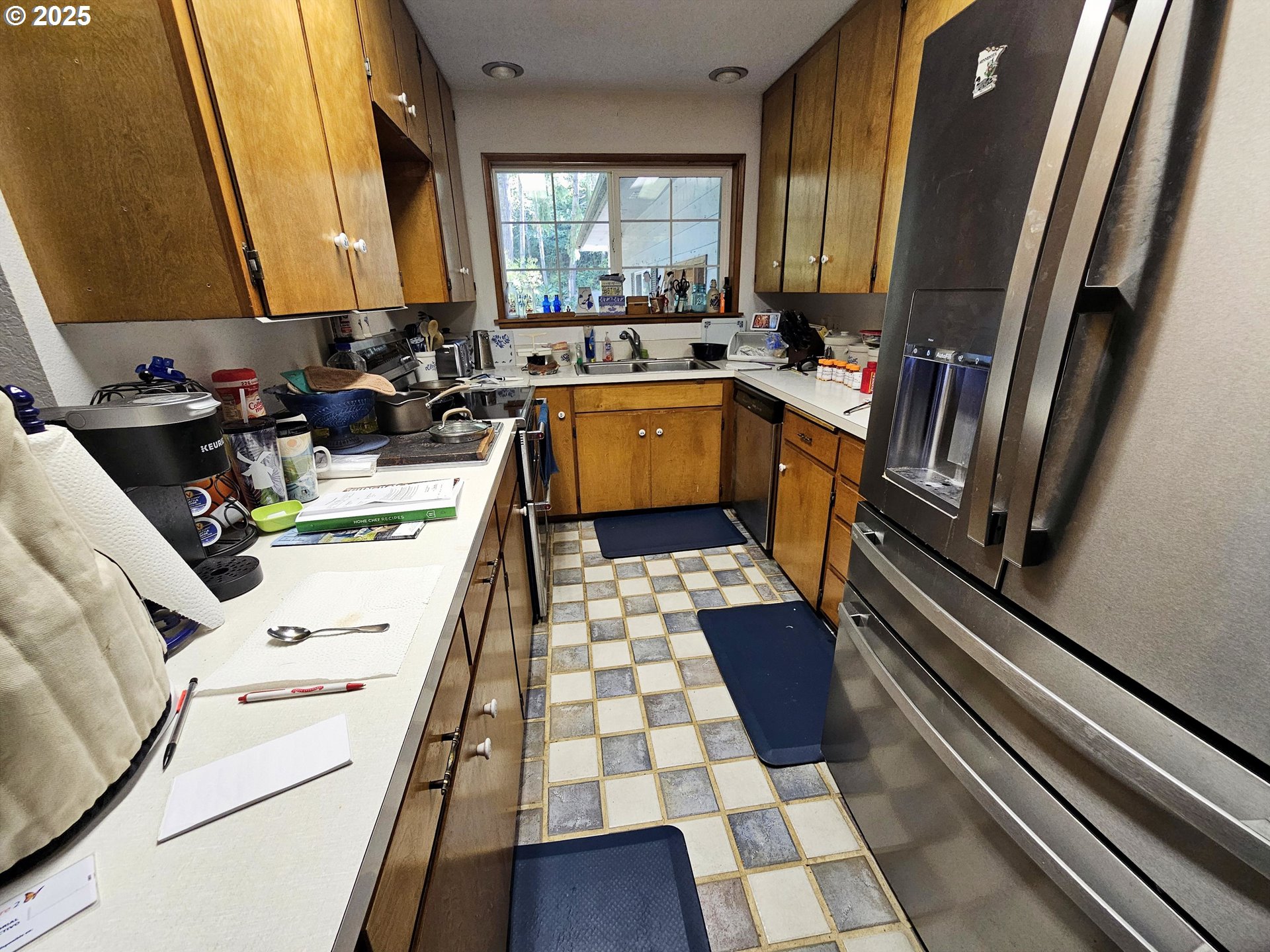 3463 Briarwood Road Umpqua, OR 97486 - Photo 4 of 29 a kitchen with a sink a stove and a refrigerator