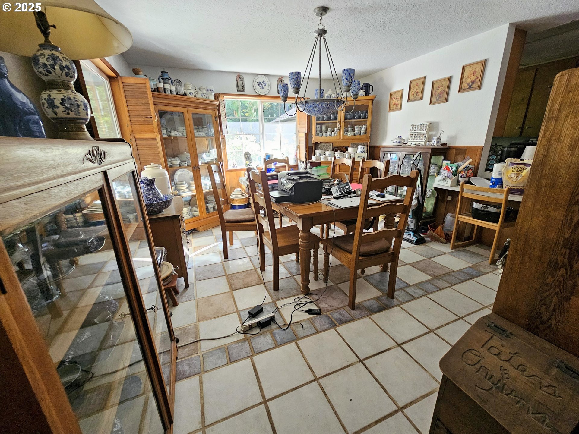 3463 Briarwood Road Umpqua, OR 97486 - Photo 5 of 29 a view of a dining room with furniture and a floor to ceiling window