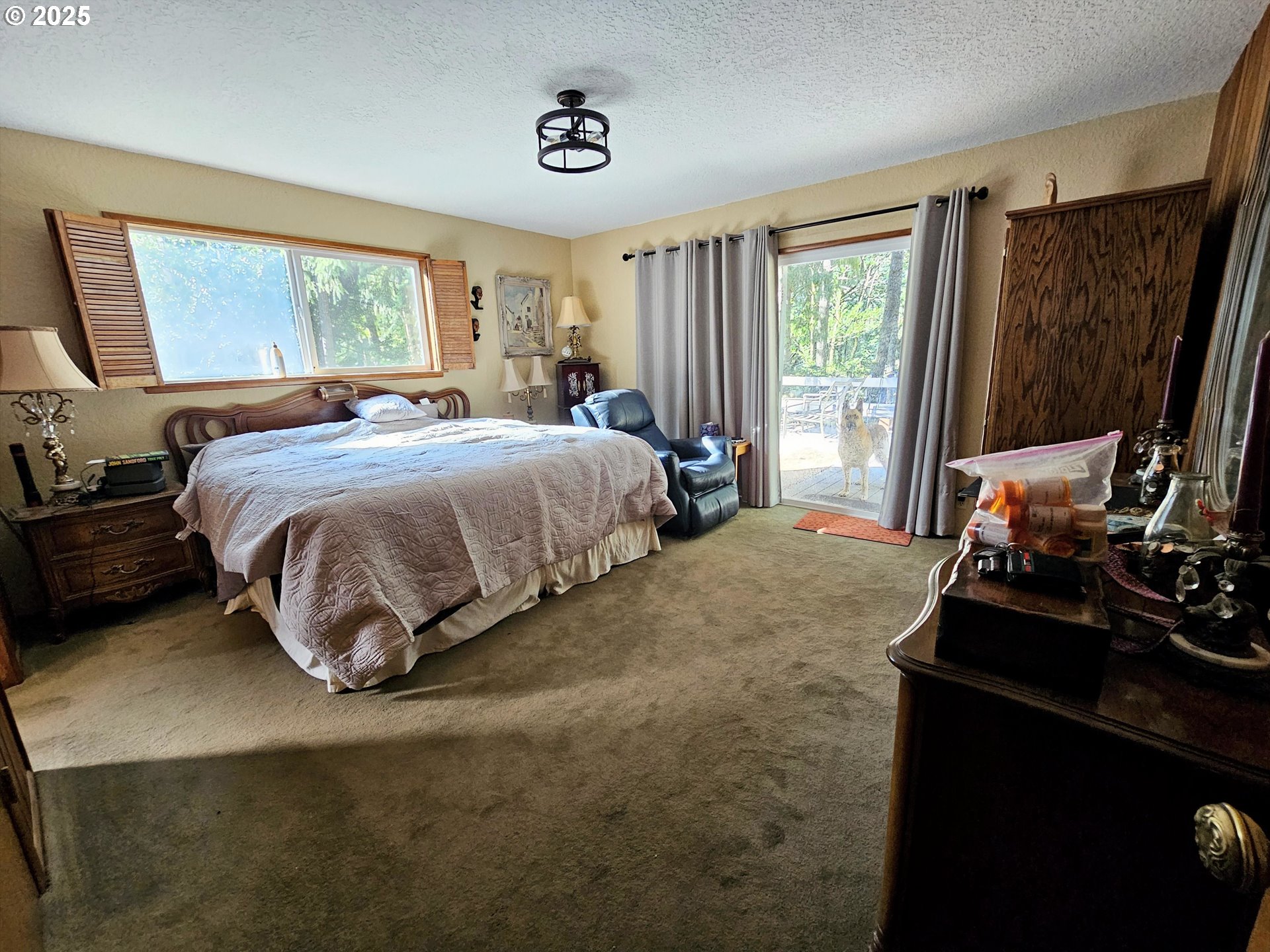 3463 Briarwood Road Umpqua, OR 97486 - Photo 6 of 29 a bedroom with a bed and a large window