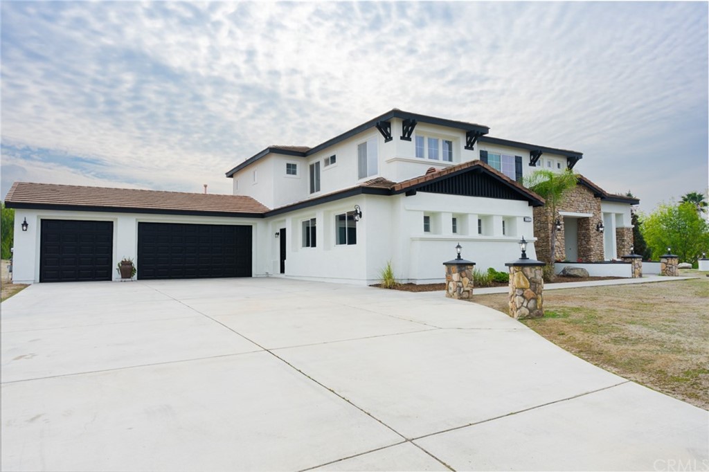 18382 Swallowtail Lane Riverside, CA 92504 - Photo 1 of 1 a front view of a house with a yard and garage