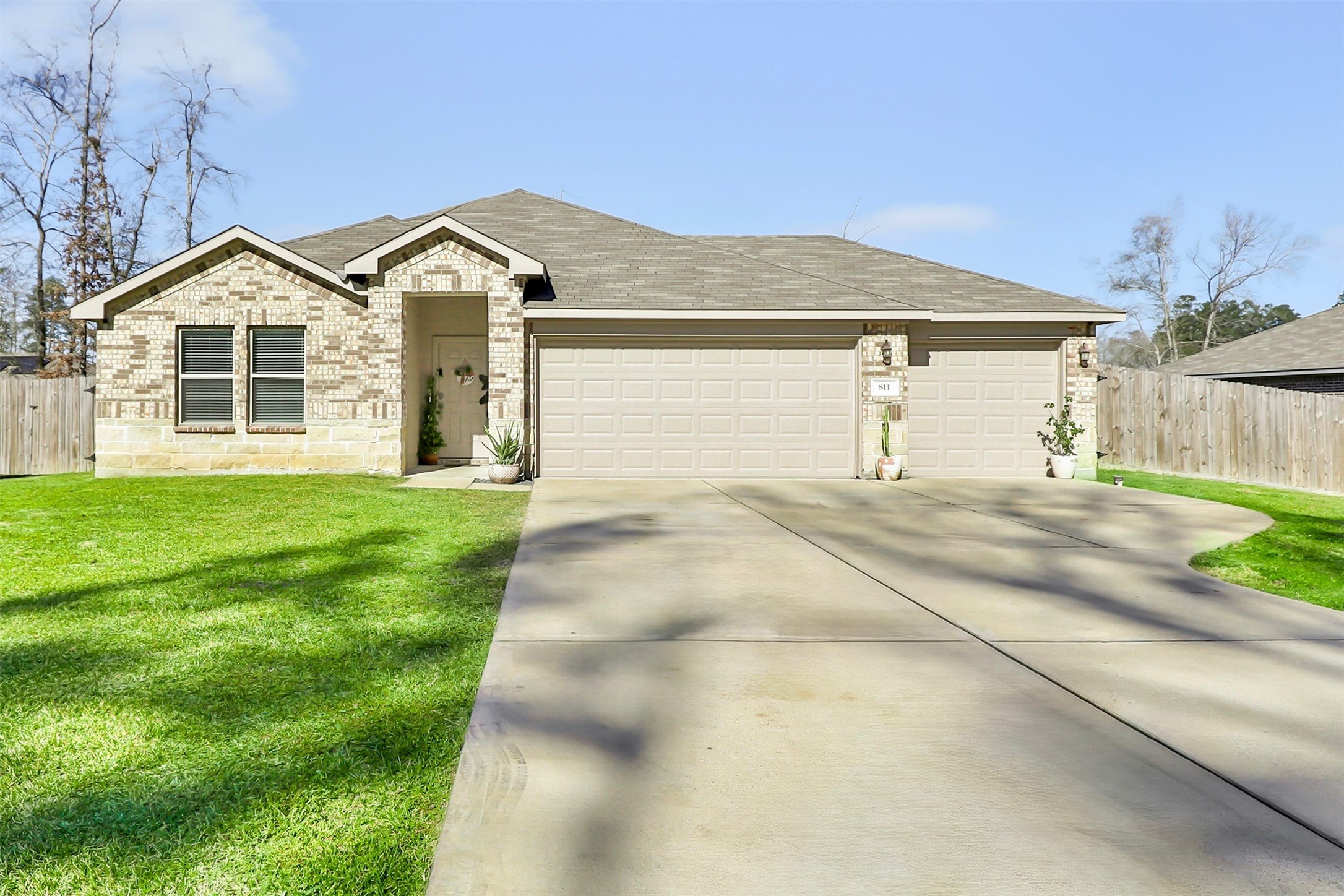 811 Republic Road New Caney, TX 77357 - Photo 1 of 37 Gorgeous single-story brick home with a spacious front lawn and a wooden fence. Located in a quiet, tree-lined neighborhood, it offers a welcoming and serene environment. Ideal for families seeking a cozy, suburban lifestyle with no HOA