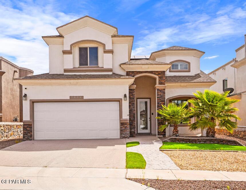 7828 Enchanted View Drive El Paso, TX 79911 - Photo 1 of 1 a front view of a house with garden