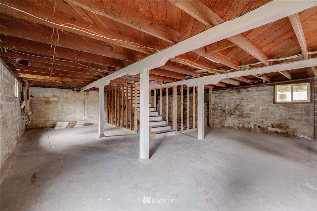 5912 Larimer Road Everett, WA 98208 - Photo 17 of 27 a view of empty room with wooden ceiling