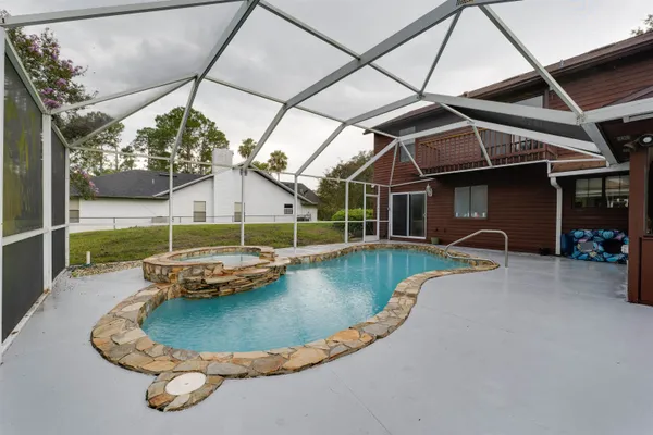 a view of a swimming pool with a patio