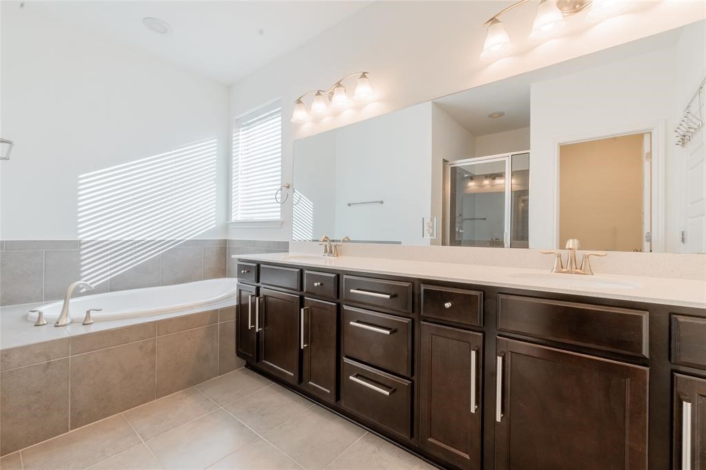 1333 Terrace View Drive Georgetown, TX 78628 - Photo 30 of 35 Indulge in a tranquil bathing experience with a large soaking tub and dual vanities.