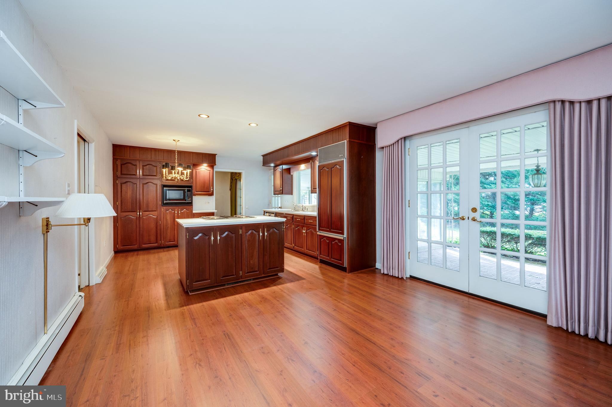 1202 Old Mill Road Wyomissing, PA 19610 - Photo 13 of 58 a room with furniture and a wooden floor