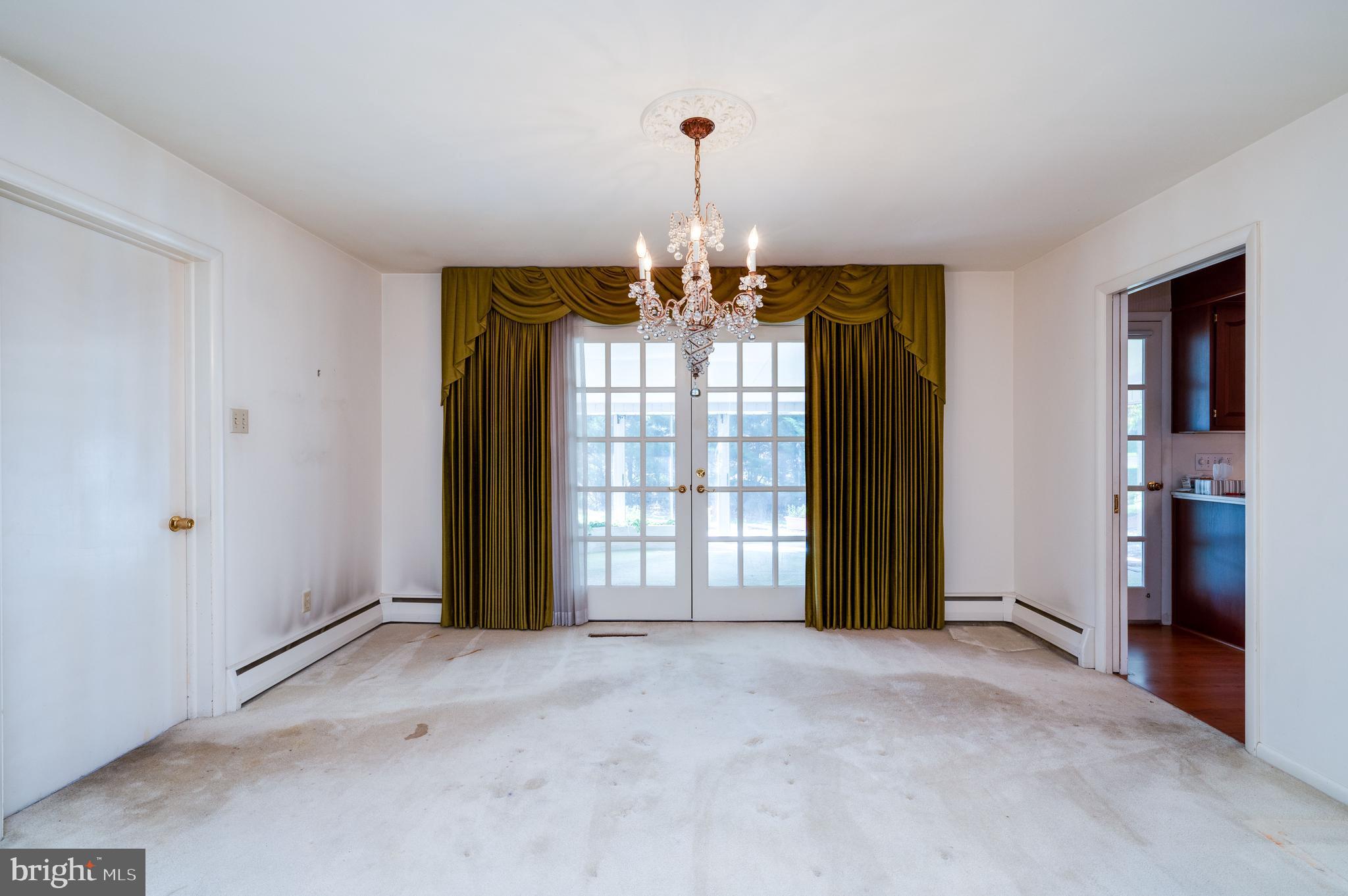 1202 Old Mill Road Wyomissing, PA 19610 - Photo 18 of 58 a view of a chandelier and window in a room
