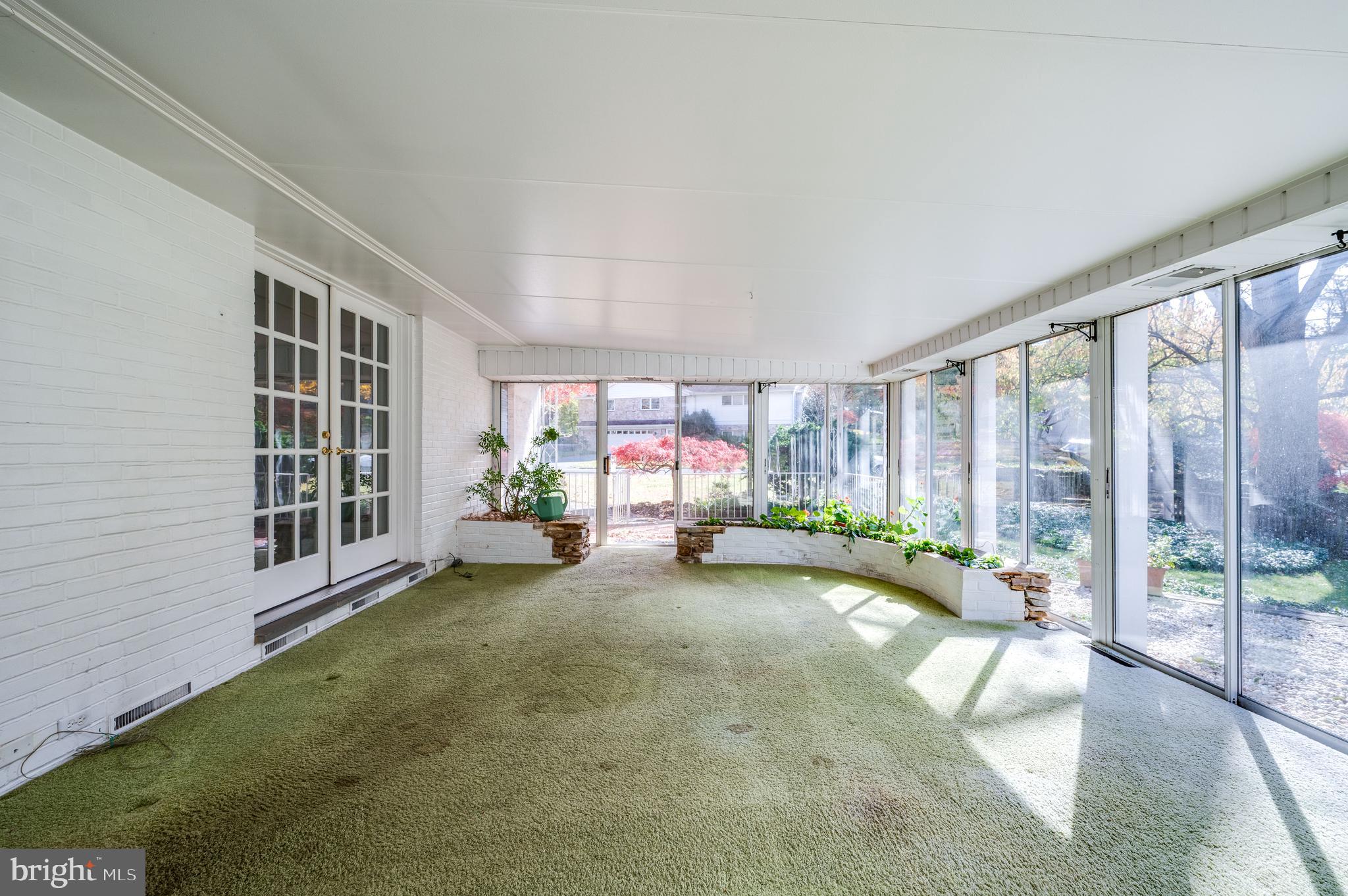 1202 Old Mill Road Wyomissing, PA 19610 - Photo 20 of 58 a view of a livingroom with furniture wooden floor and a large window