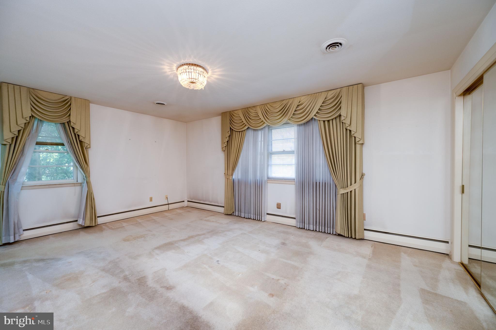 1202 Old Mill Road Wyomissing, PA 19610 - Photo 23 of 58 an empty room with windows and closet