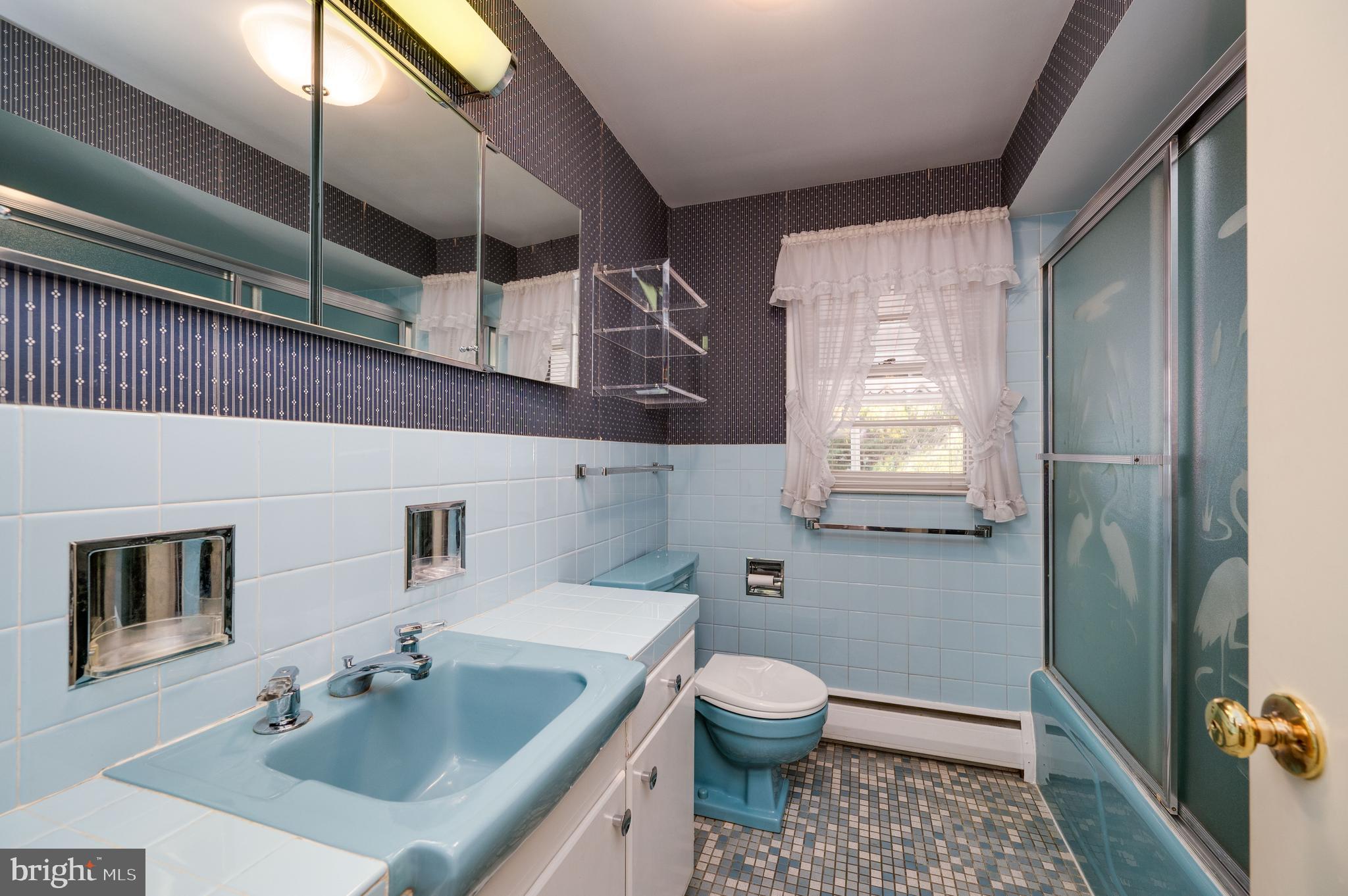 1202 Old Mill Road Wyomissing, PA 19610 - Photo 28 of 58 a bathroom with a sink a toilet and shower