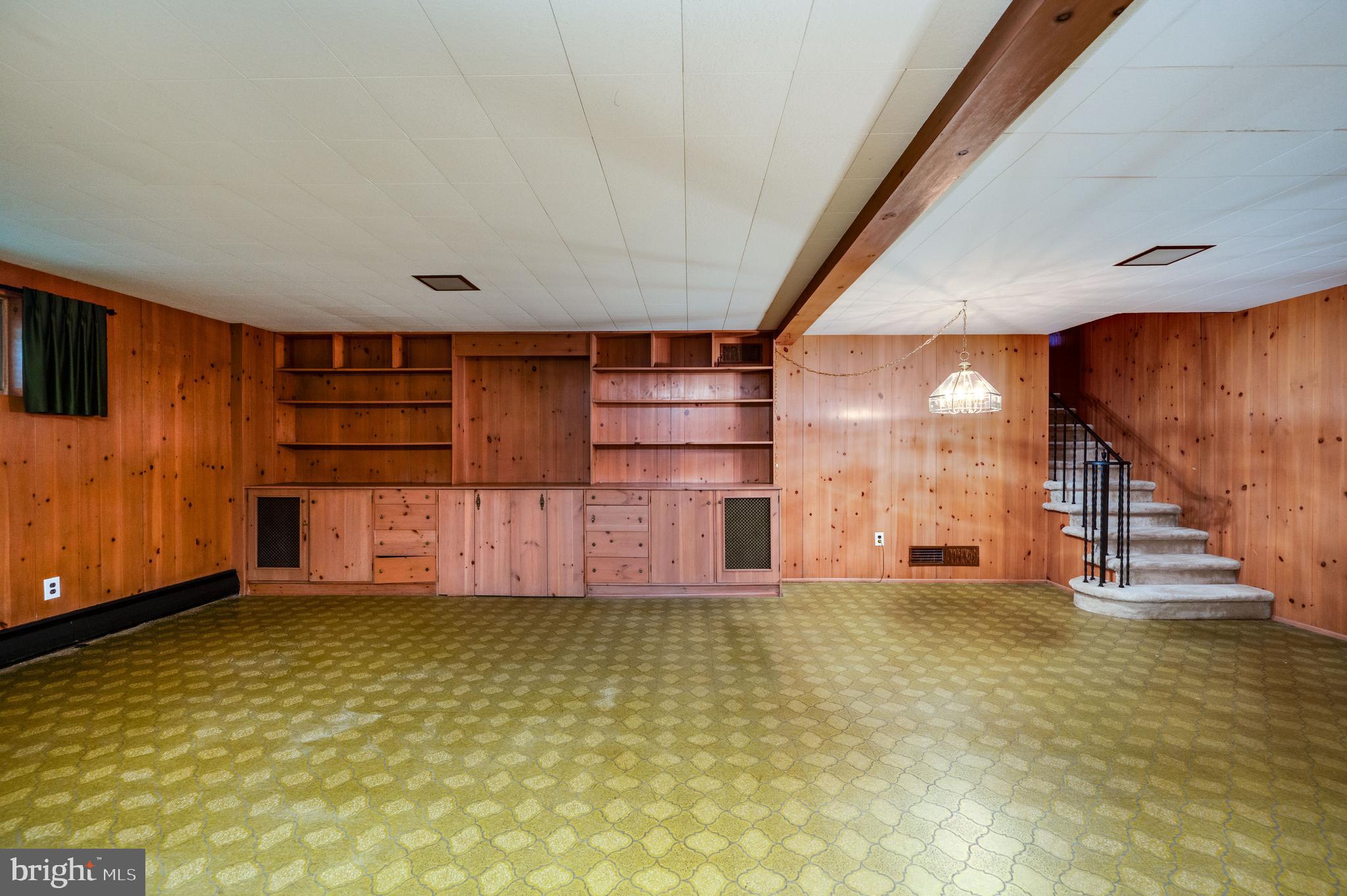 1202 Old Mill Road Wyomissing, PA 19610 - Photo 39 of 58 a view of a room with wooden floor and stairs