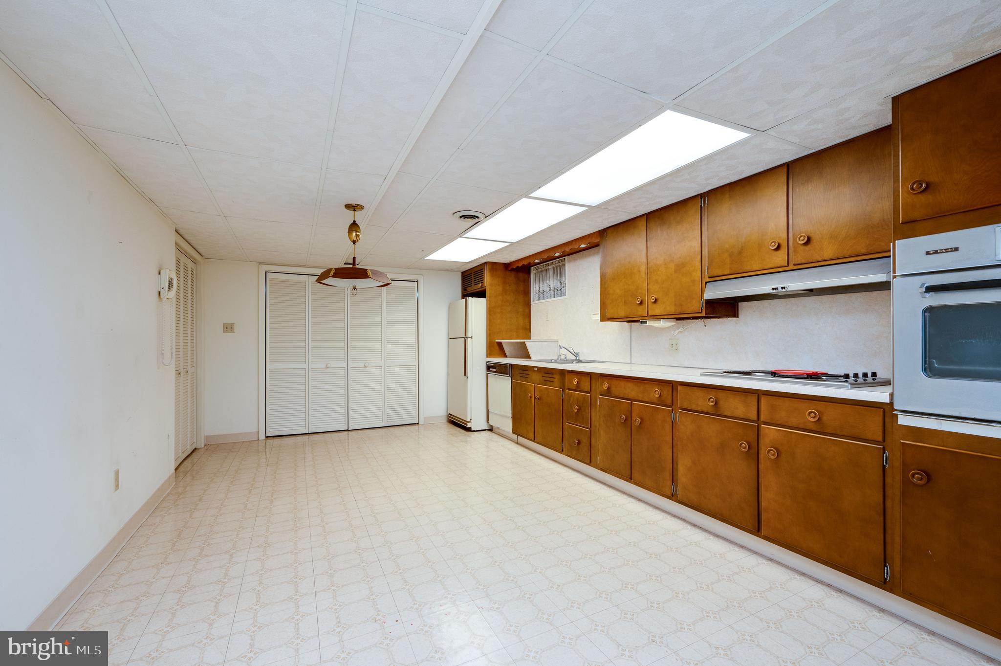 1202 Old Mill Road Wyomissing, PA 19610 - Photo 43 of 58 a kitchen with stainless steel appliances granite countertop a sink a stove and cabinets