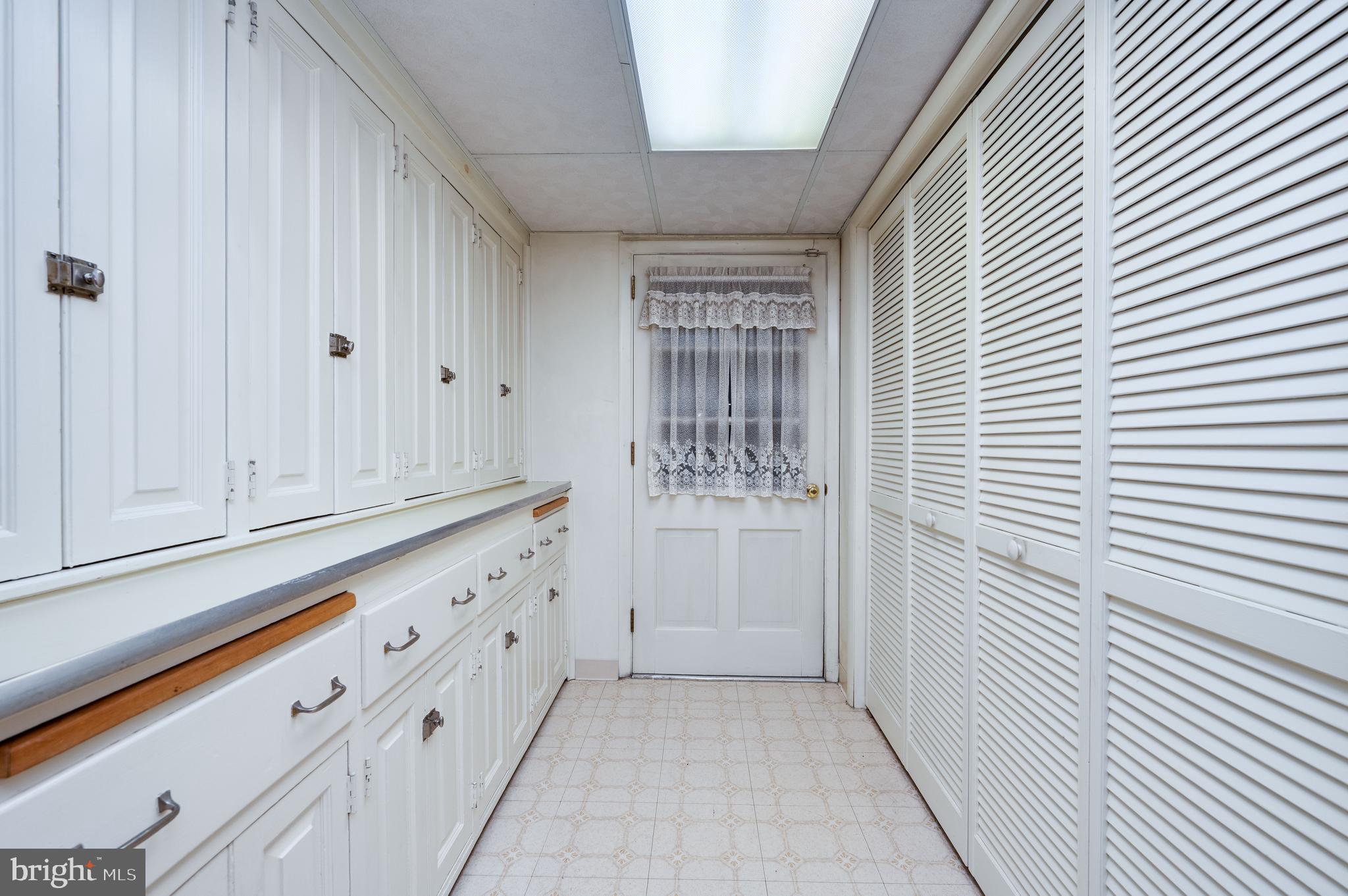 1202 Old Mill Road Wyomissing, PA 19610 - Photo 45 of 58 a view of a kitchen with white cabinets