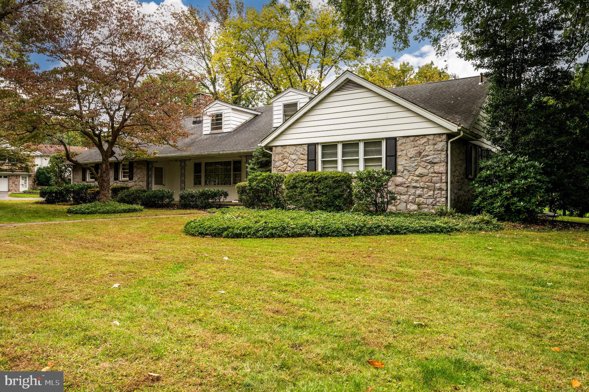 1202 Old Mill Road Wyomissing, PA 19610 - Photo 57 of 58 a front view of a house with a yard