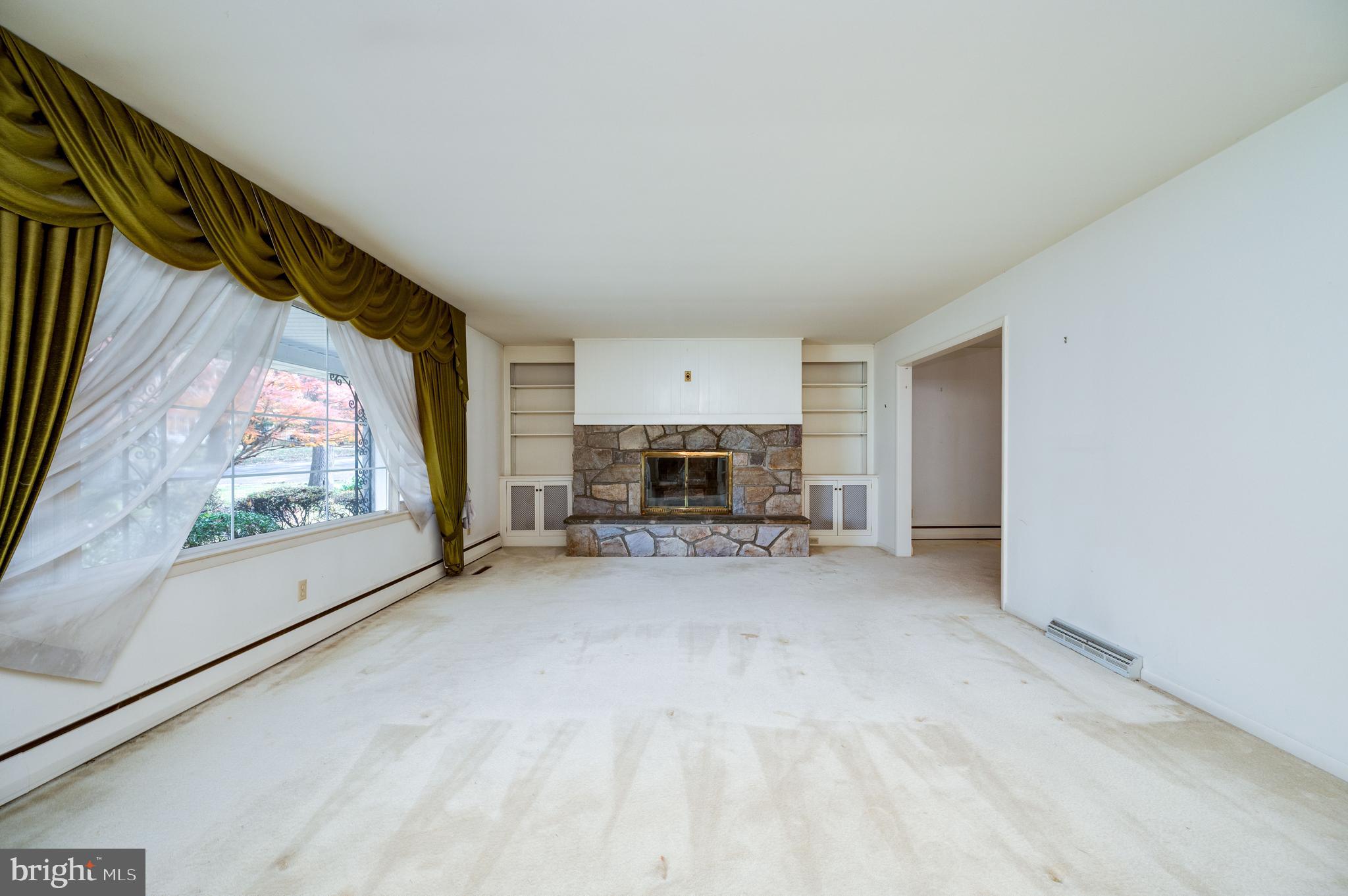 1202 Old Mill Road Wyomissing, PA 19610 - Photo 7 of 58 a view of a livingroom with furniture and a fireplace