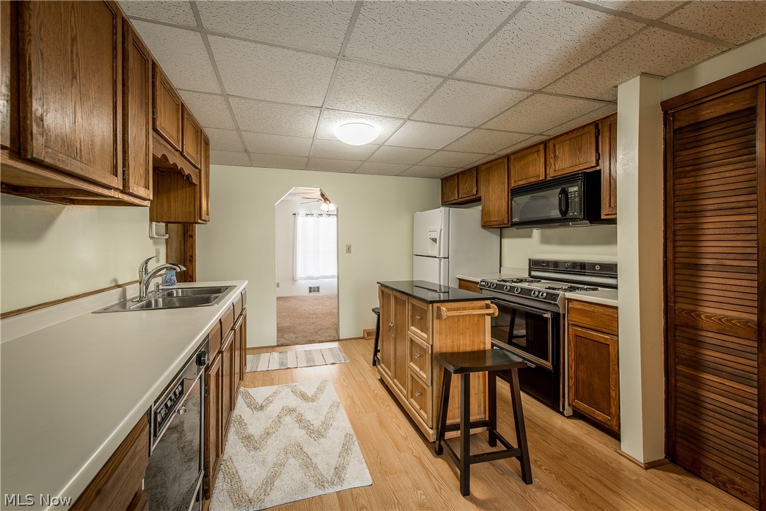 2901 Ries Street Norton, OH 44203 - Photo 12 of 28 An archway leads into the dining room