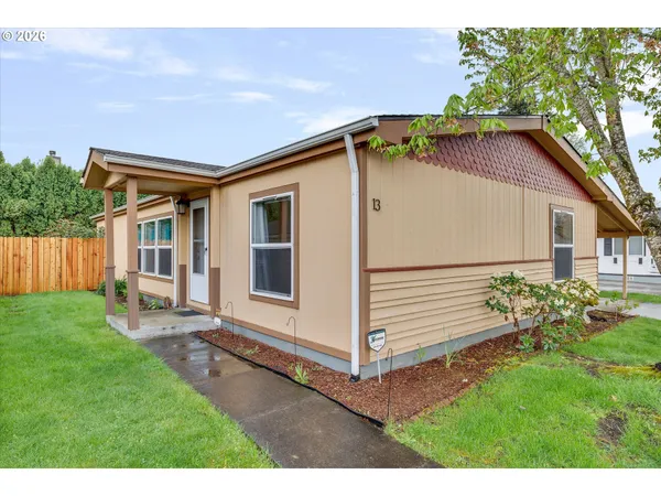 a backyard of a house with wooden fence