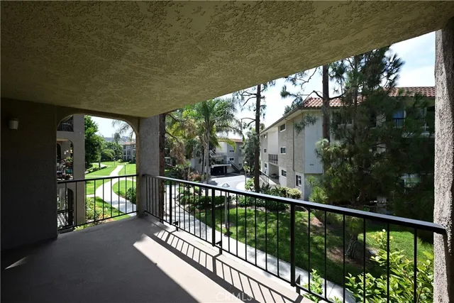 a view of a balcony with wooden floor