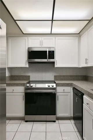 a kitchen with a stove and a microwave