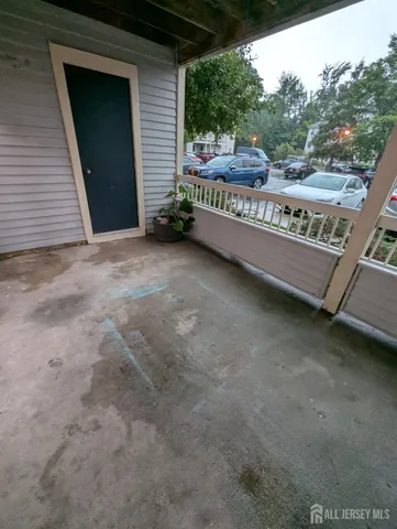 a view of a bench in front of a house