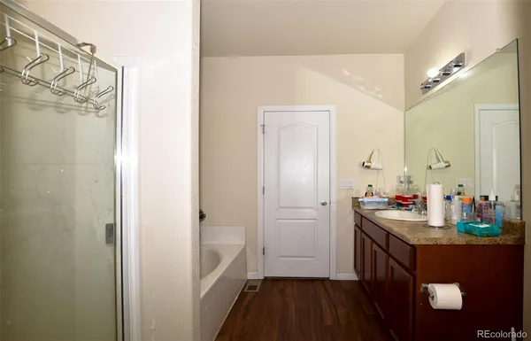 a bathroom with a sink a mirror and a shower