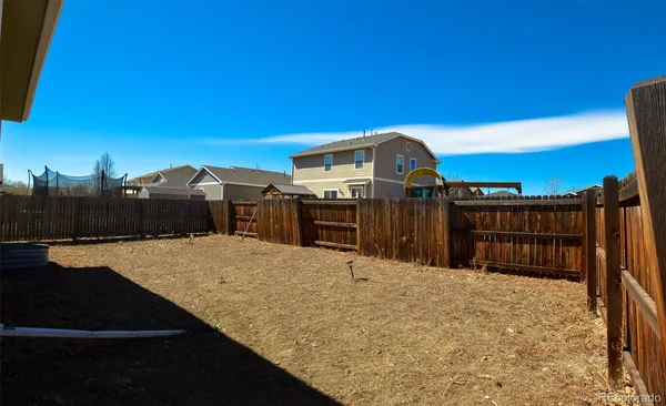 a view of a backyard of the house