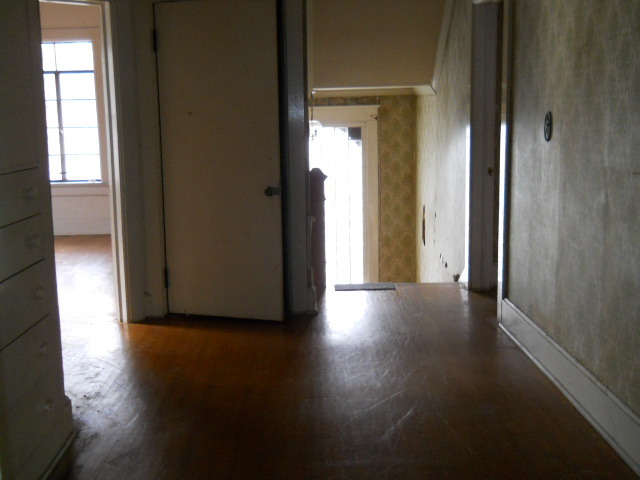 802 West 3rd Street Sterling, IL 61081 - Photo 15 of 21 a view of a hallway with wooden floor