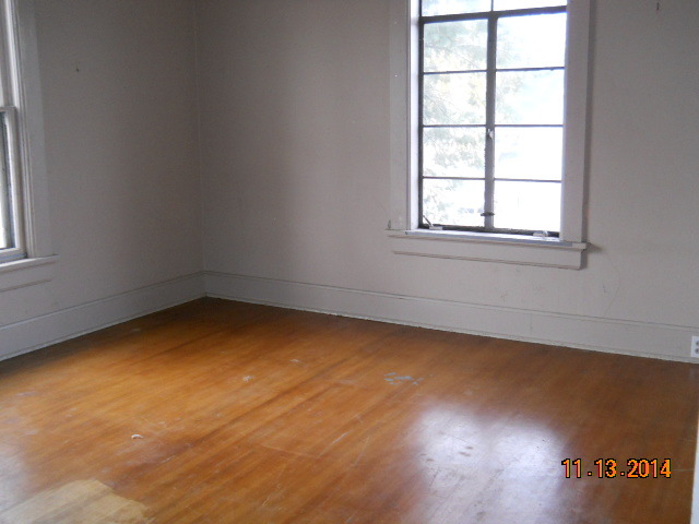 802 West 3rd Street Sterling, IL 61081 - Photo 2 of 21 an empty room with a window