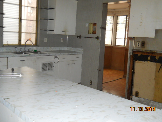 802 West 3rd Street Sterling, IL 61081 - Photo 21 of 21 a kitchen with a sink stove and cabinets