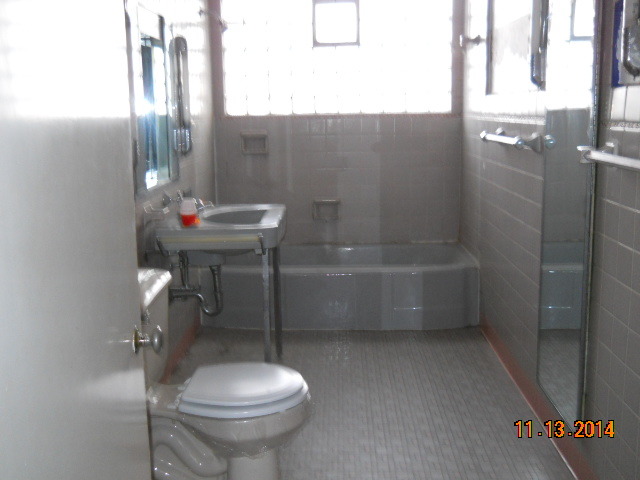 802 West 3rd Street Sterling, IL 61081 - Photo 7 of 21 a bathroom with a sink and toilet