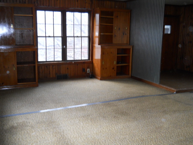 802 West 3rd Street Sterling, IL 61081 - Photo 10 of 21 an empty room with windows