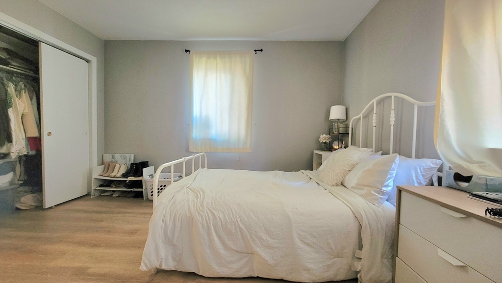200 Kelton Street, Unit 14 Boston, MA 02134 - Photo 5 of 7 a bedroom with a bed and a window