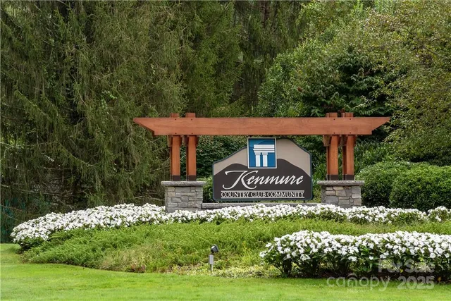 a front view of a house with a yard and road