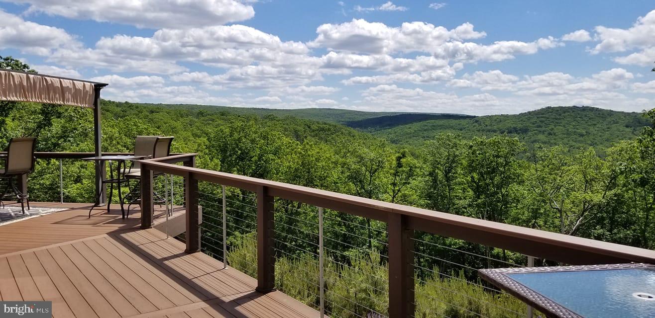 729 High Mountain Road Gardners, PA 17324 - Photo 3 of 15 a view of a balcony with wooden floor & fence