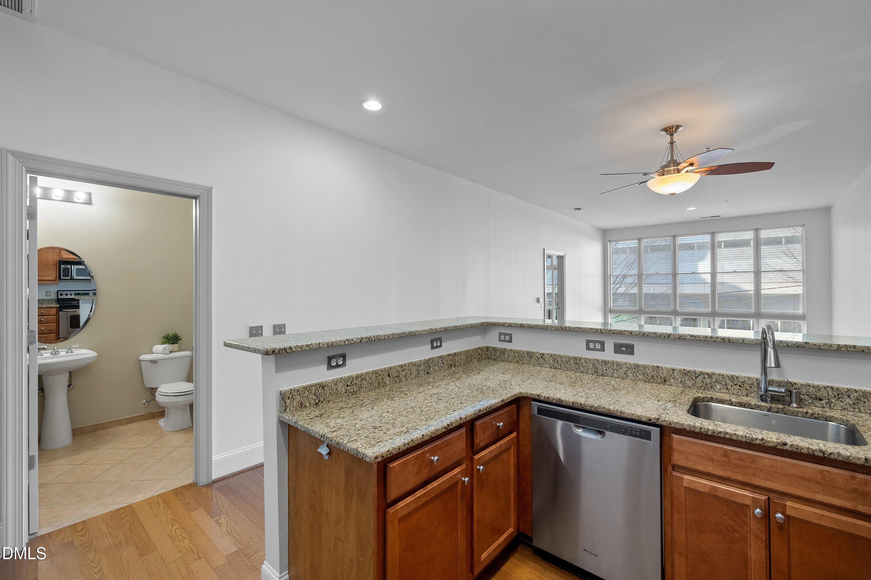 317 West Morgan Street, Unit 215 Raleigh, NC 27601 - Photo 11 of 38 a kitchen with a sink and cabinets