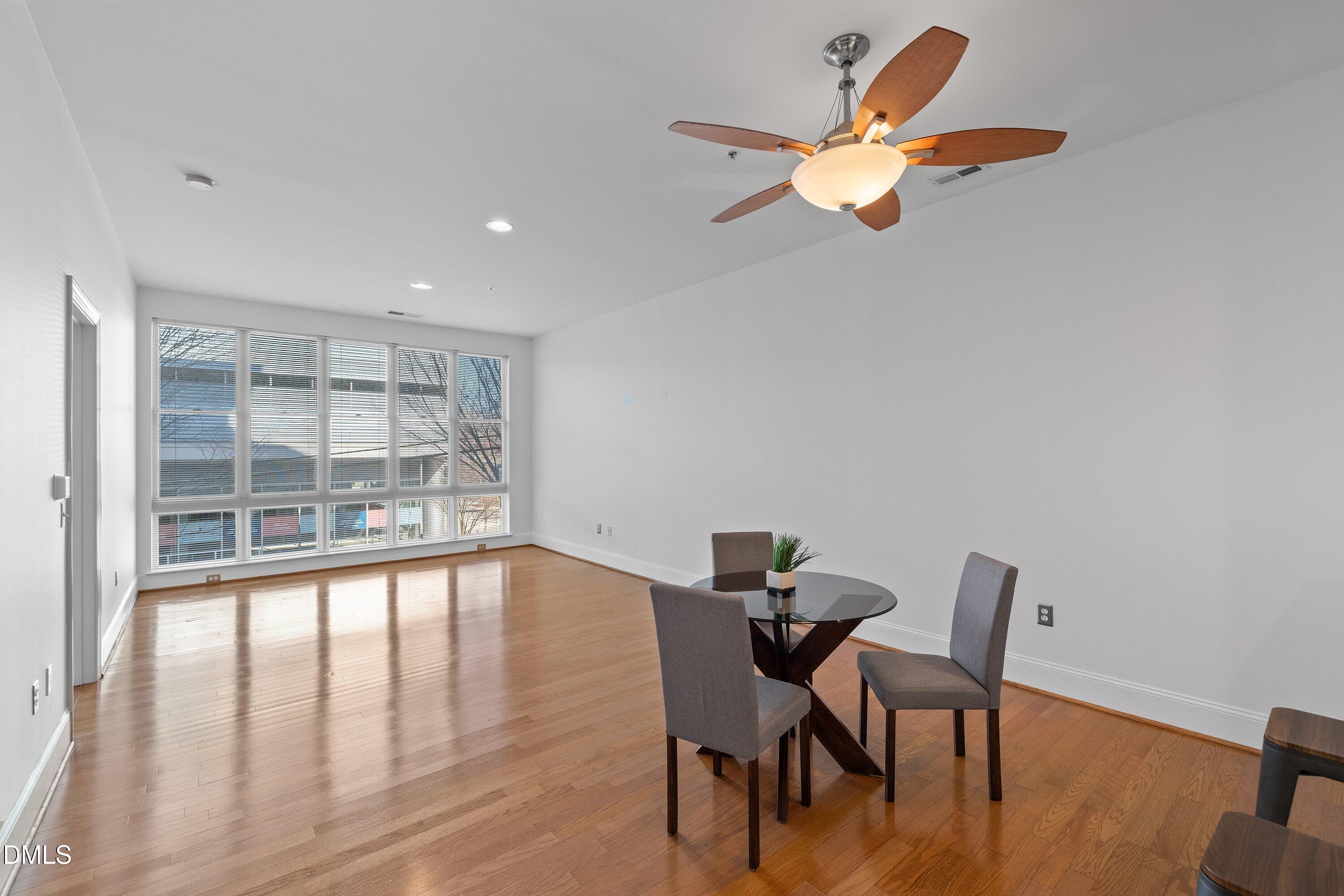 317 West Morgan Street, Unit 215 Raleigh, NC 27601 - Photo 13 of 38 a view of a workspace with furniture and a window