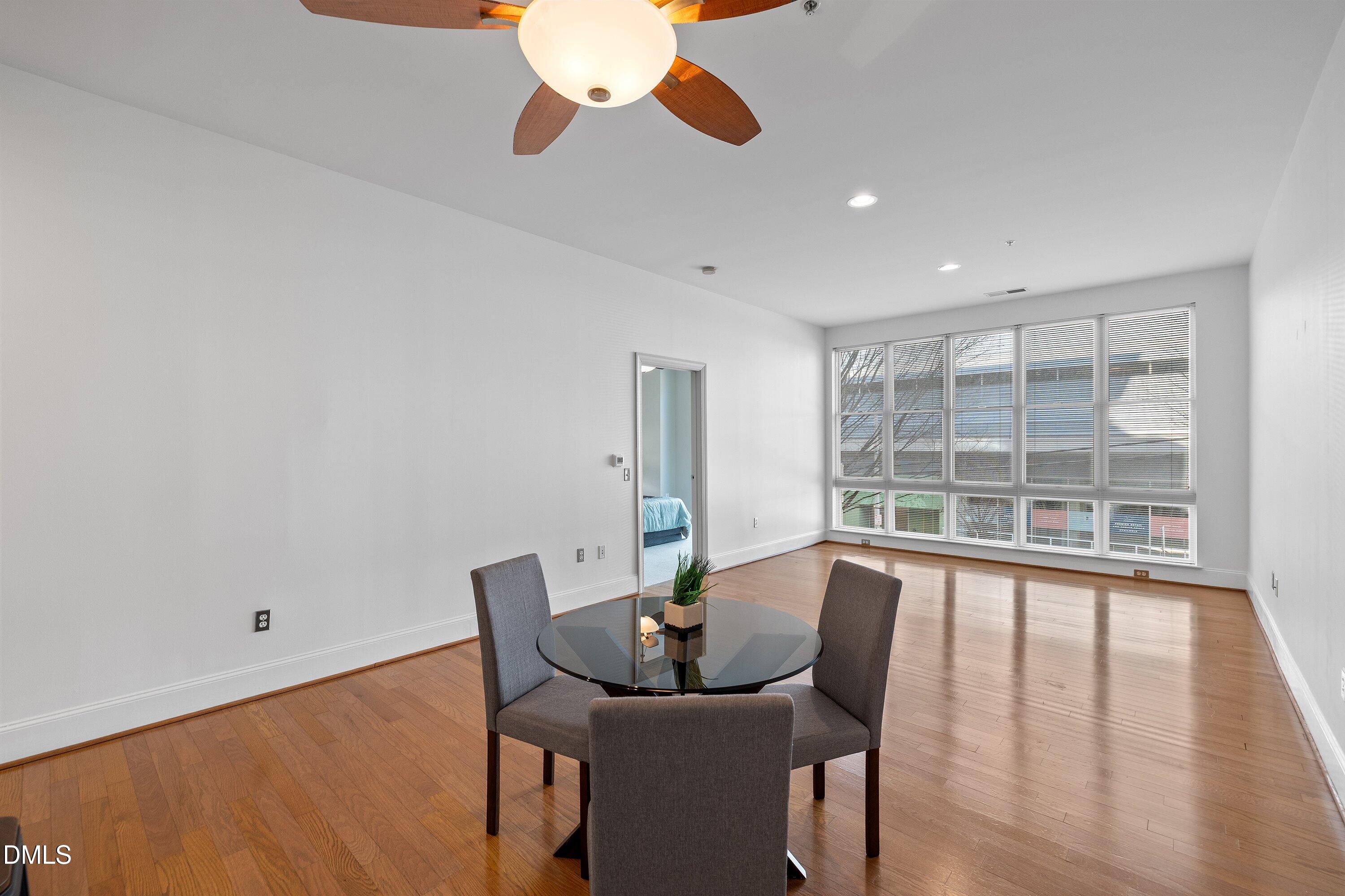 317 West Morgan Street, Unit 215 Raleigh, NC 27601 - Photo 14 of 38 a view of a dining room with furniture window and outside view