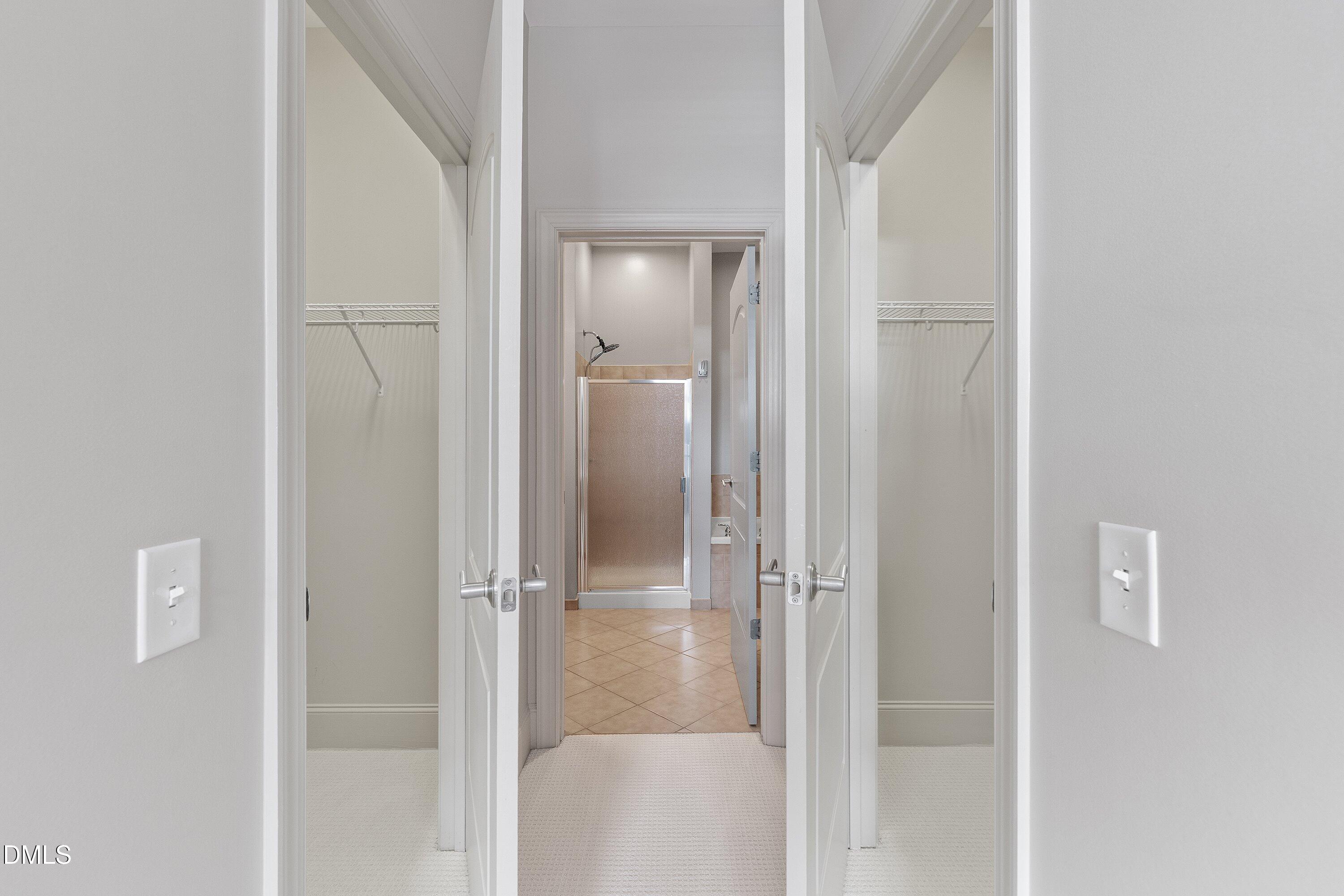 317 West Morgan Street, Unit 215 Raleigh, NC 27601 - Photo 19 of 38 a bathroom with a glass shower door